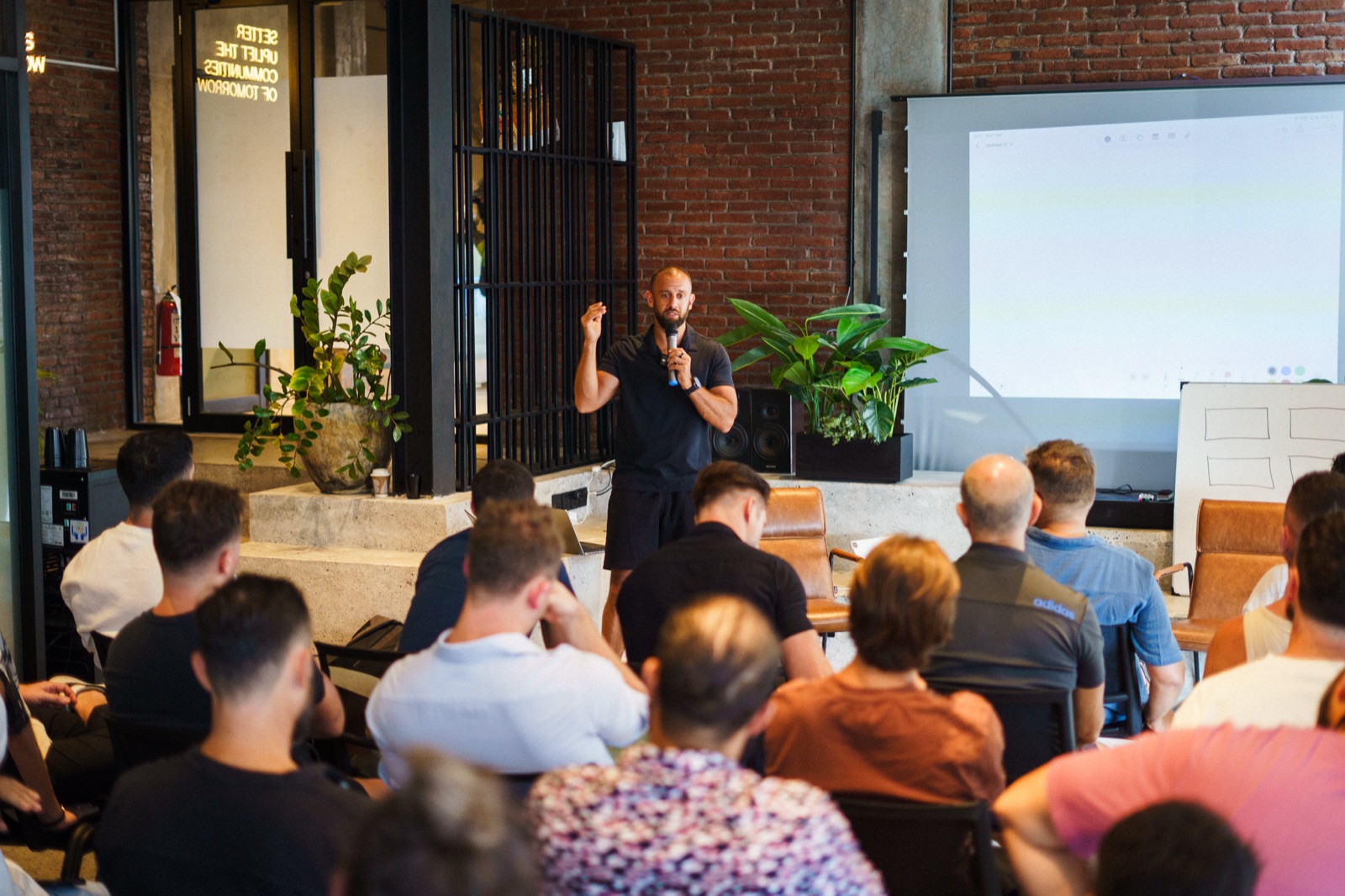 Founder presenting an AI masterclass to a room of business owners
